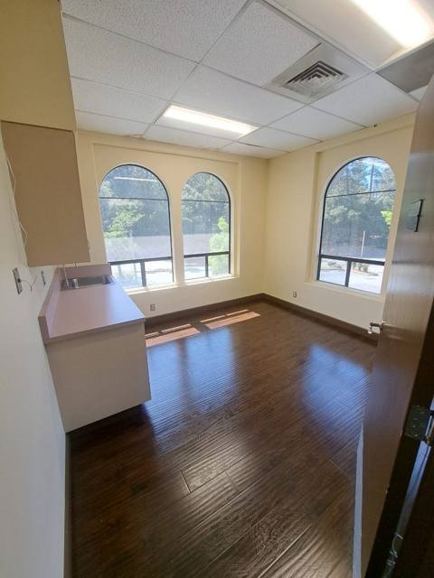 Unit 204 — bright room with arched windows