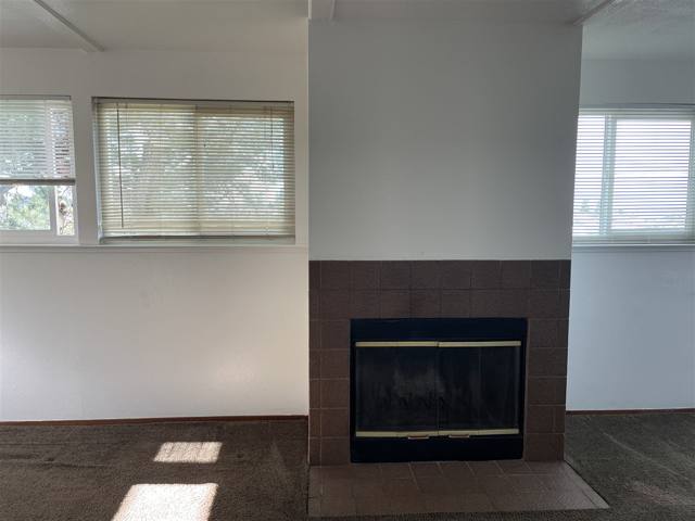 Unit living room with fireplace
